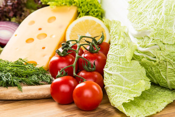 yellow cheese with fresh vegetables