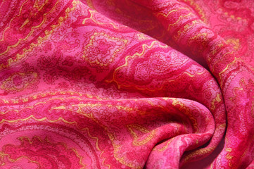 Red paisley background, cloth texture