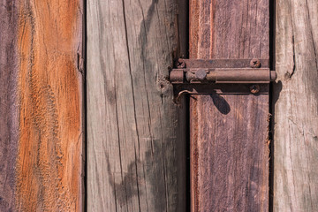 Rustic weathered barn wood background with knots with door lock