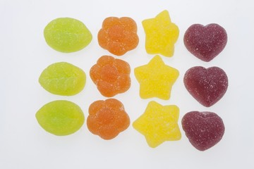 Jelly candies on white background. Gummy candy on a white background. We like gelatin. Childhood obesity.
