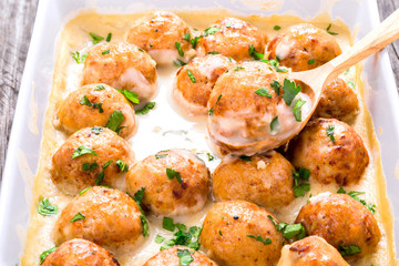meatballs  in a creamy gravy sauce, close-up