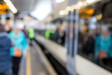 Train At Platform & People. Soft Focus. Railway Station Background.