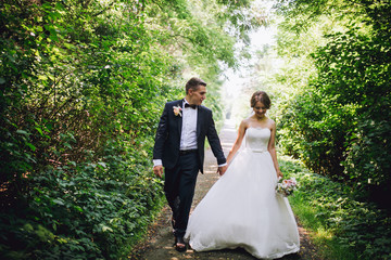 Married Couple in forest embracing