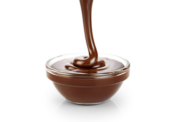 Pouring dark melted chocolate isolated on white background.