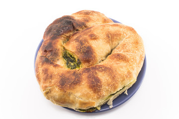 Snail pie with spinach and cheese