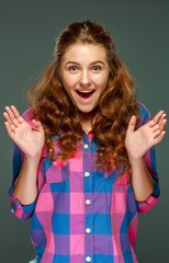 Portrait surprised young brunette woman with wavy hair