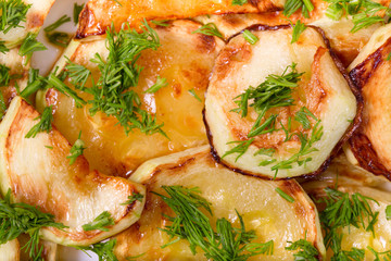 Appetizing vegetable marrows, fried in oil and strewed with gree