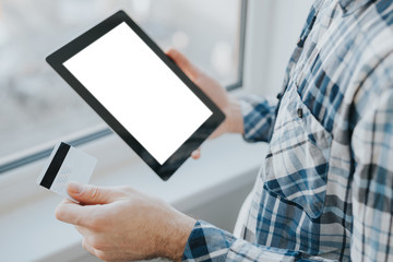 Online shopping concept with credit card and tablet