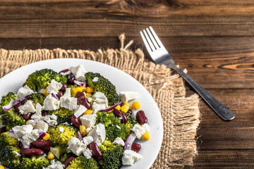 Broccoli salad with vegetables and feta cheese.