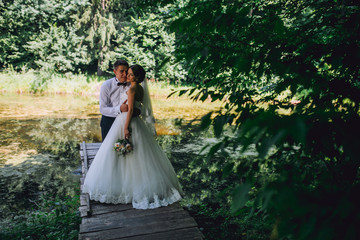 Fototapeta premium Married Couple in forest embracing