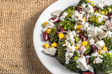 Broccoli salad with vegetables and feta cheese.