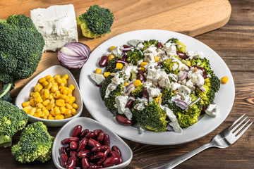 Broccoli salad with vegetables and feta cheese. © alicja neumiler