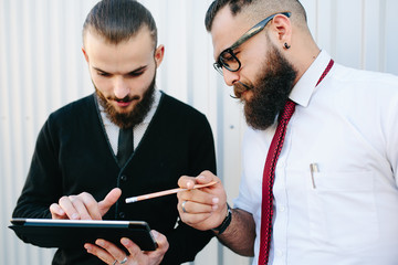 Two businessmen discussing something