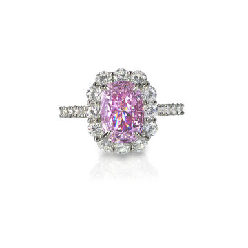 Pink diamond halo engagement wedding ring isolated on white