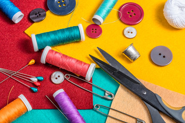 Various sewing accessories on a colored felt.
