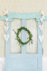 Turquoise wooden door with decor