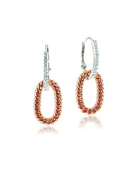 Rose gold and white gold diamond earrings isolated on white