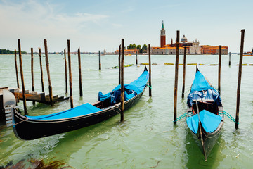 Fototapeta na wymiar classic Venice Gondolas against Saint Giorgio bell tower