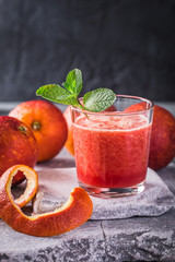 Blood orange fresh drink on stone background