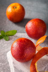 Blood oranges on stone