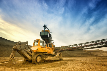 One side of huge mining drill machine and dredger photographed from a ground with wide angle lens....