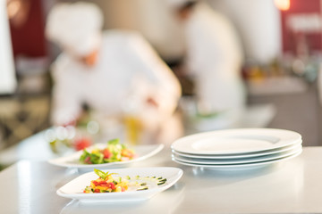 Obraz na płótnie Canvas Close-up of stylish plates of colorful cut vegetables
