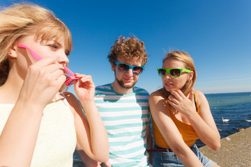 Group friends boy two girls having fun outdoor