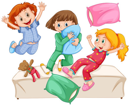Three girls playing pillow fight at the slumber party