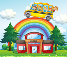 Children on school bus riding over the rainbow