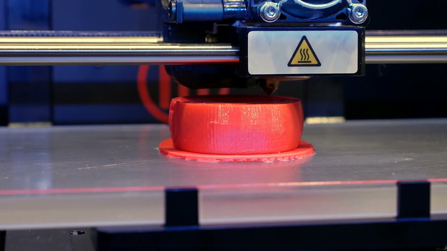 Automatic three dimensional 3d printer performs plastic modeling in laboratory. Modern 3D printing technology. Close-up shot. 4K UHD video footage.