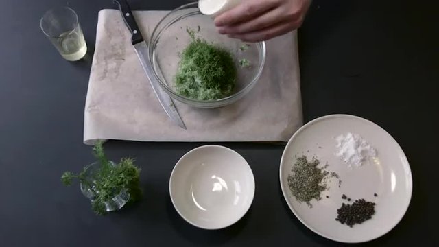 Male Chef Adds and Mixes a White Sauce