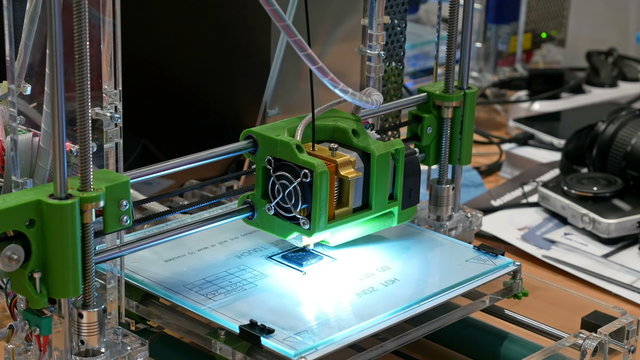 Automatic three dimensional 3d printer performs plastic modeling in laboratory. Modern 3D printing technology. Close-up shot. 4K UHD video footage.