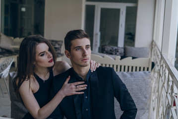 Beautiful fashion couple in cafe