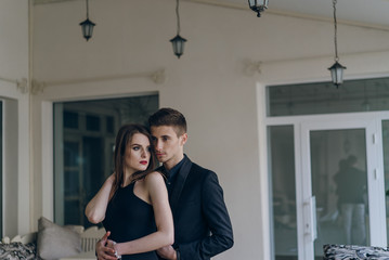 Beautiful fashion couple in cafe