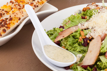 lettuce salad with ham and Parmesan cheese