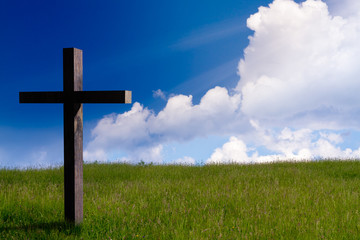jesus christ cross. Easter resurrection concept. christian cross on spring background with blue...