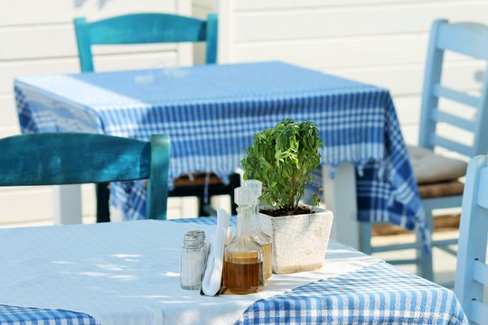 Greek restaurant tables and chairs outside, Beautiful greek tavern. Mediterranean. stock, photo, photograph, image, picture, 