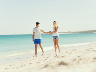 Romantic young couple on the beach