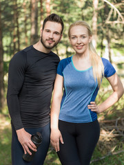 Fototapeta premium Portrait Of Male And Female Runners in nature