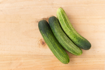top view of Cucumber on wood background