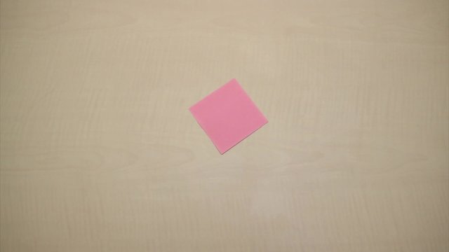 Somebody sticks stickers on the table