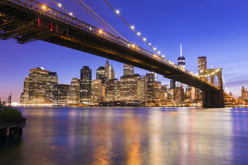 Fototapeta na wymiar Brooklyn Bridge at dusk viewed from the Brooklyn Bridge Park in New York City.