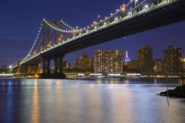 Fototapeta na wymiar New York City Skyline and Manhattan Bridge At Night
