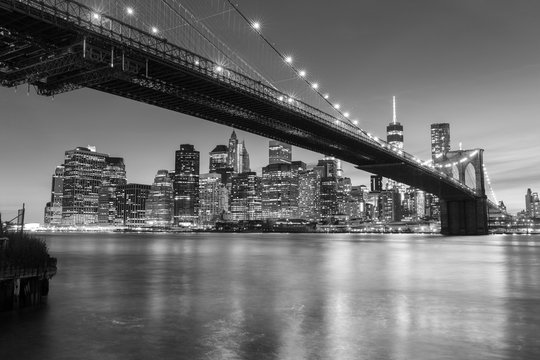 Brooklyn Bridge at dusk viewed from the Brooklyn Bridge Park in New York City. © davidevison