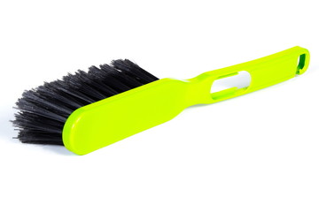 New green broom for cleaning on white background