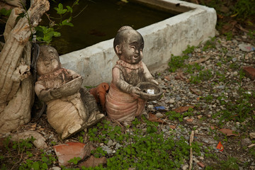 The two ancient sculptures of boys in Thailand