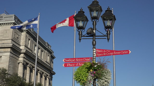 Signs and flags in front of Bonsecours market building, Montreal, Canada