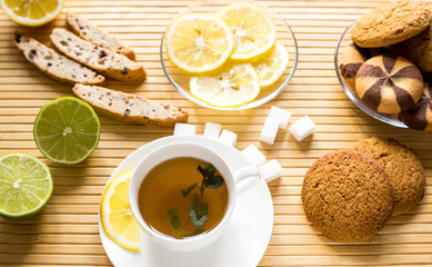 Green tea with mint, cookies, lime and lemon