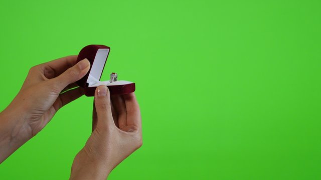 Displaying silver ring in the box greenscreen display 4K 2160p UltraHD footage - Woman holding box with a ring and displaying on green screen display 4K 3840X2160 UHD video 