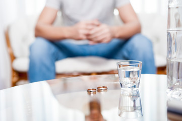 Fototapeta premium divorce / Flooded a wedding ring in a glass of vodka / Vodka reason for the disintegration of many marriages